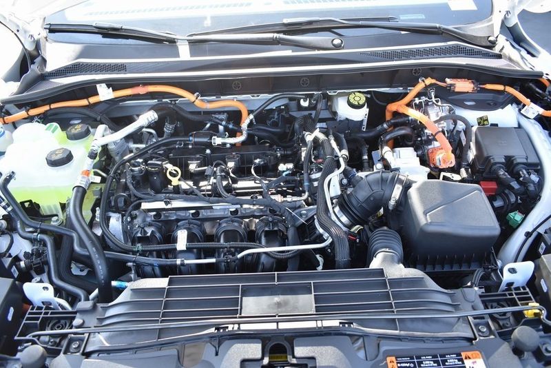 2023 Ford Escape Plug-In Hybrid in a Star White Metallic Tri Coat exterior color and Ebonyinterior. BEACH BLVD OF CARS beachblvdofcars.com 