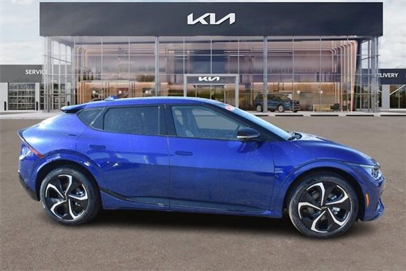 2024 Kia EV6 GT-Line in a Yacht Blue exterior color and Blackinterior. Raymond Auto Group 888-703-9950 raymonddeals.com 