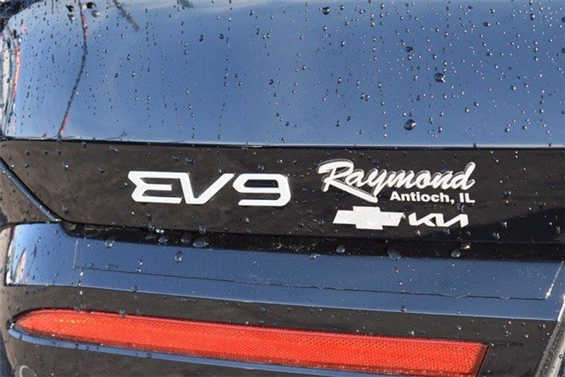 2024 Kia EV9 Land in a Aurora Blue exterior color and Gry Syntex Lth Seatsinterior. Raymond Auto Group 888-703-9950 raymonddeals.com 
