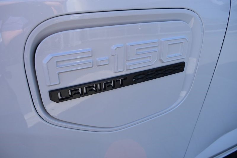 2023 Ford F-150 Lightning Lariat in a White Metallic exterior color and Blackinterior. BEACH BLVD OF CARS beachblvdofcars.com 