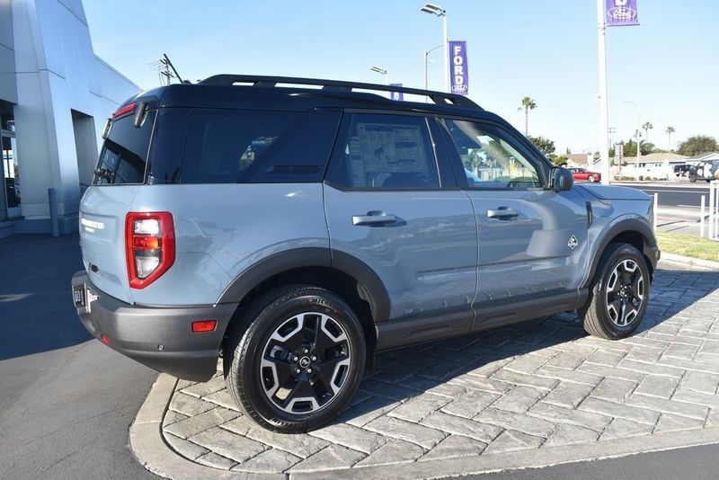 2024 Ford Bronco Sport Outer Banks in a Azure Gray Metallic Tri Coat exterior color and Navy Pierinterior. BEACH BLVD OF CARS beachblvdofcars.com 