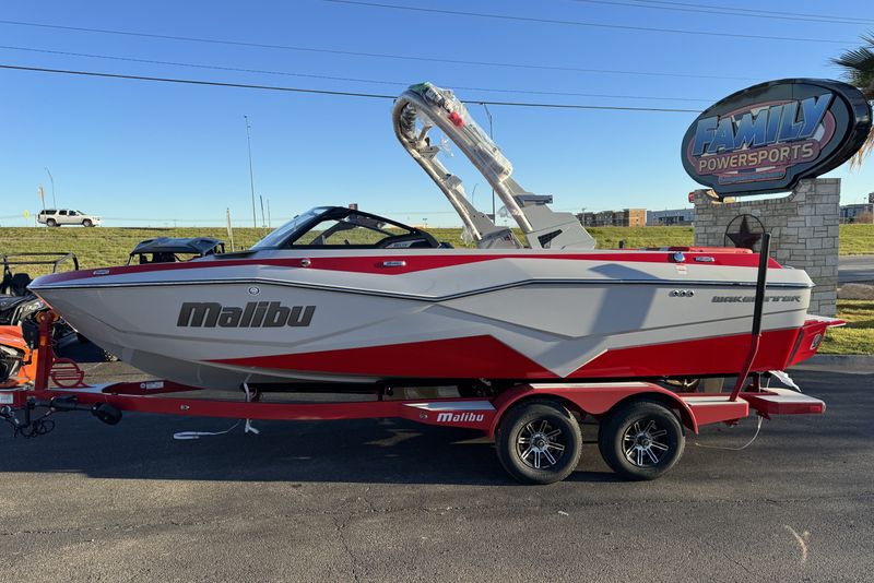 2024 MALIBU WAKESETTER 22 LSV  RED  LIGHT GRAPHITE  in a RED/GREY exterior color. Family PowerSports (877) 886-1997 familypowersports.com 