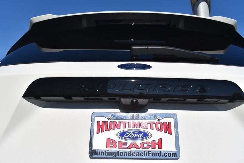 2023 Ford Explorer ST in a Star White Metallic Tri Coat exterior color and Ebonyinterior. BEACH BLVD OF CARS beachblvdofcars.com 