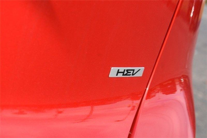 2024 Kia Niro EX Touring in a Runway Red exterior color and Grayinterior. Raymond Auto Group 888-703-9950 raymonddeals.com 