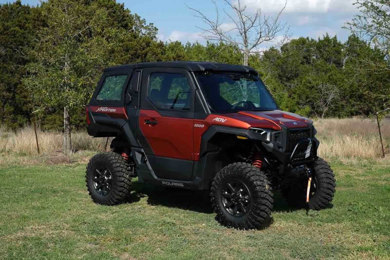 2024 POLARIS XPEDITION ADV 1000 NSTR Matte Orange Rust in a ORANGE exterior color. Family PowerSports (877) 886-1997 familypowersports.com 