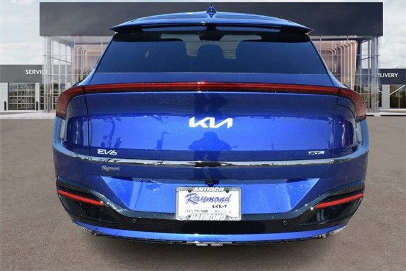 2024 Kia EV6 GT-Line in a Yacht Blue exterior color and Blackinterior. Raymond Auto Group 888-703-9950 raymonddeals.com 