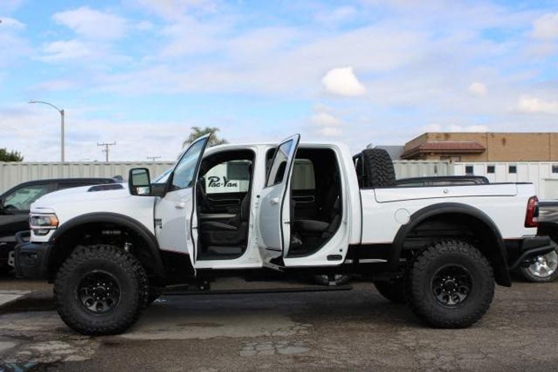 2023 RAM 2500 Laramie Crew Cab 4x4 in a Bright White exterior color and Blackinterior. BEACH BLVD OF CARS beachblvdofcars.com 