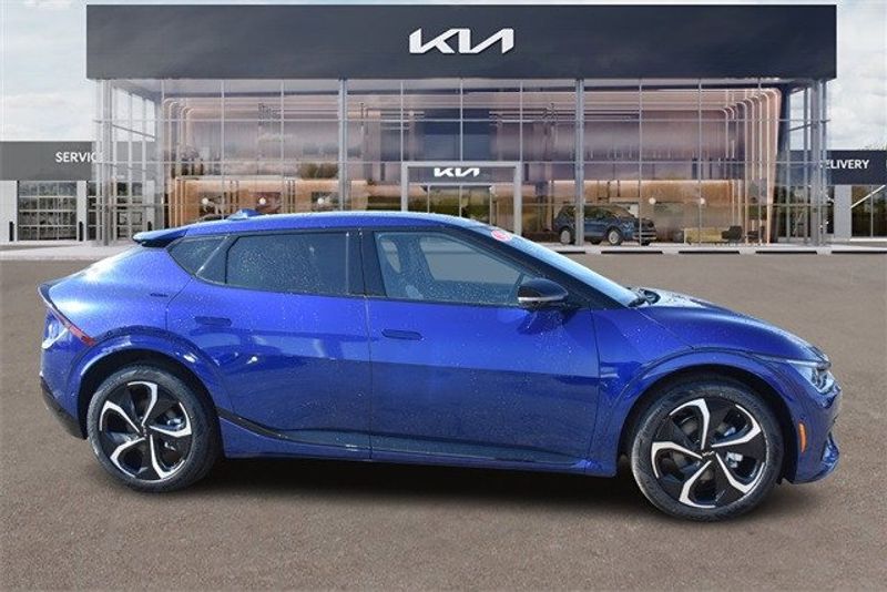 2024 Kia EV6 GT-Line in a Yacht Blue exterior color and Blackinterior. Raymond Auto Group 888-703-9950 raymonddeals.com 