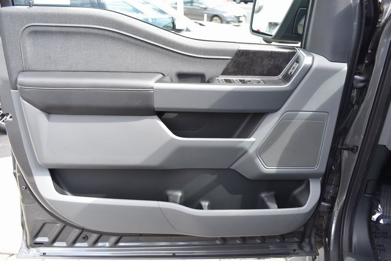 2023 Ford F-150 Lightning XLT in a Carbonized Gray Metallic exterior color and Medium Dark Slateinterior. BEACH BLVD OF CARS beachblvdofcars.com 