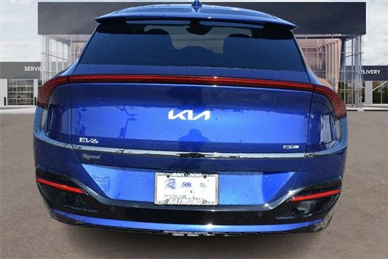 2024 Kia EV6 GT-Line in a Yacht Blue exterior color and Blackinterior. Raymond Auto Group 888-703-9950 raymonddeals.com 