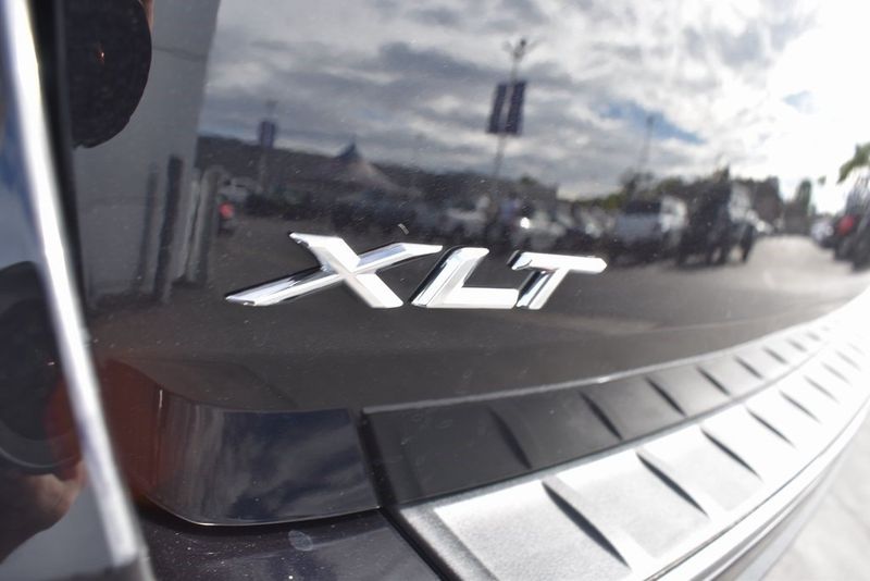 2023 Ford Explorer XLT in a Agate Black Metallic exterior color and Light Slateinterior. BEACH BLVD OF CARS beachblvdofcars.com 