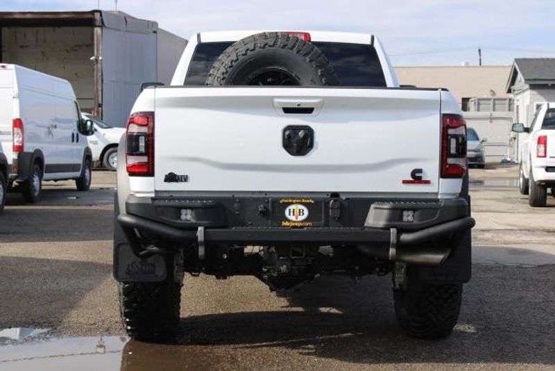 2023 RAM 2500 Laramie Crew Cab 4x4 in a Bright White exterior color and Blackinterior. BEACH BLVD OF CARS beachblvdofcars.com 