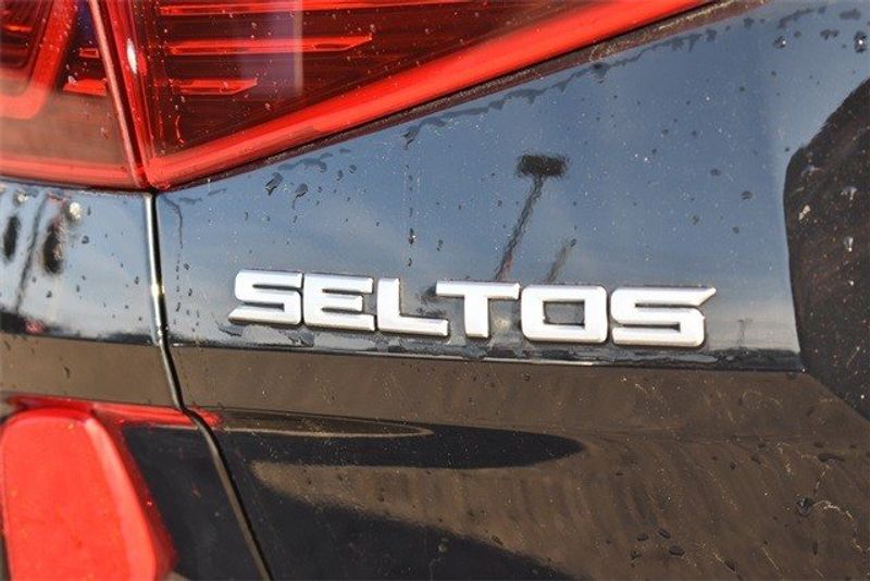 2023 Kia Seltos SX in a Cherry Black exterior color and Blackinterior. Raymond Auto Group 888-703-9950 raymonddeals.com 