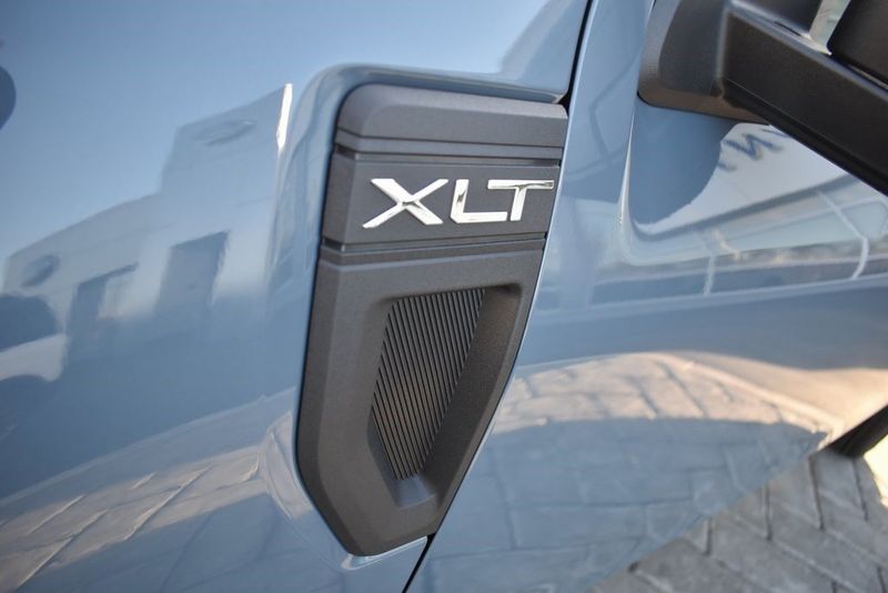 2024 Ford Maverick XLT in a Azure Gray Metallic Tri Coat exterior color and Blueinterior. BEACH BLVD OF CARS beachblvdofcars.com 