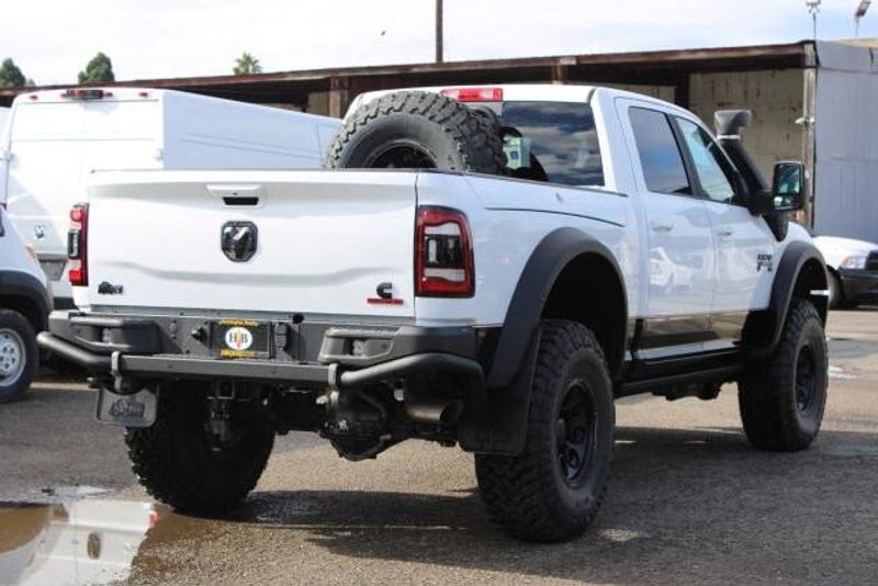 2023 RAM 2500 Laramie Crew Cab 4x4 in a Bright White exterior color and Blackinterior. BEACH BLVD OF CARS beachblvdofcars.com 