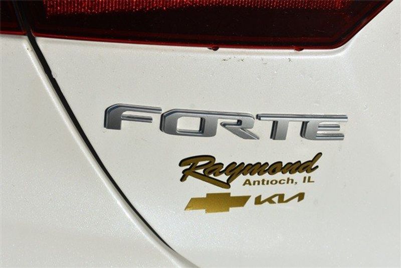 2023 Kia Forte LXS in a Snow White Pearl exterior color and Blackinterior. Raymond Auto Group 888-703-9950 raymonddeals.com 