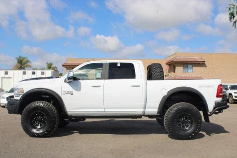 2023 RAM 2500 Laramie Crew Cab 4x4 in a Bright White exterior color and Blackinterior. BEACH BLVD OF CARS beachblvdofcars.com 