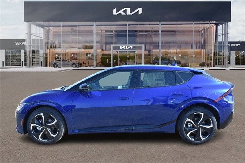 2024 Kia EV6 GT-Line in a Yacht Blue exterior color and Blackinterior. Raymond Auto Group 888-703-9950 raymonddeals.com 