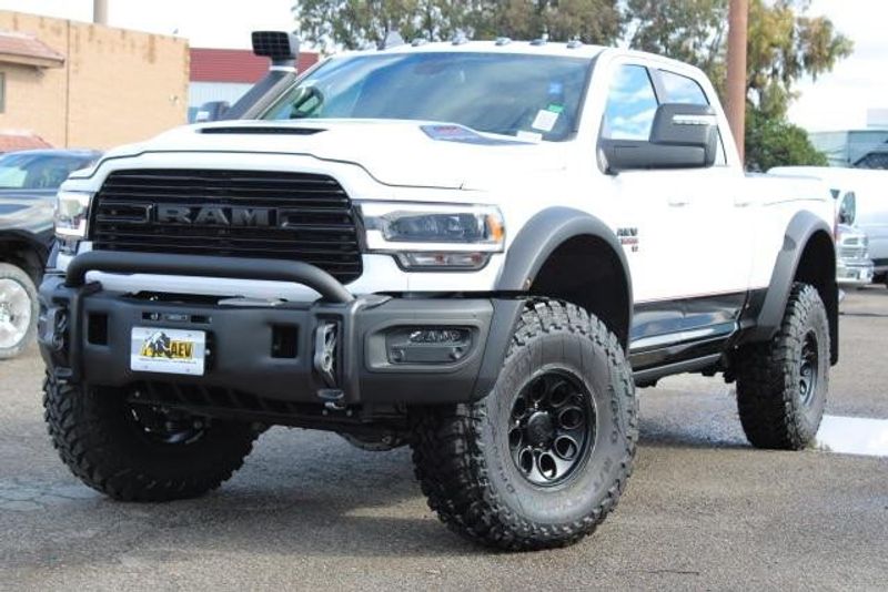 2023 RAM 2500 Laramie Crew Cab 4x4 in a Bright White exterior color and Blackinterior. BEACH BLVD OF CARS beachblvdofcars.com 