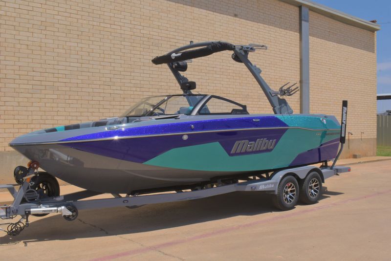 2023 MALIBU 23 LSV  in a AZURE/PURPLE exterior color. Family PowerSports (877) 886-1997 familypowersports.com 