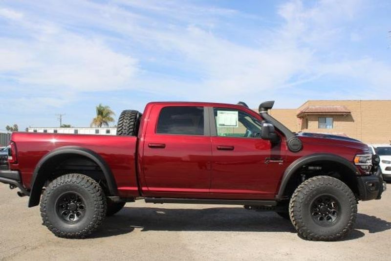 2023 RAM 2500 Laramie Crew Cab 4x4 in a Delmonico Red Pearl Coat exterior color and Blackinterior. BEACH BLVD OF CARS beachblvdofcars.com 