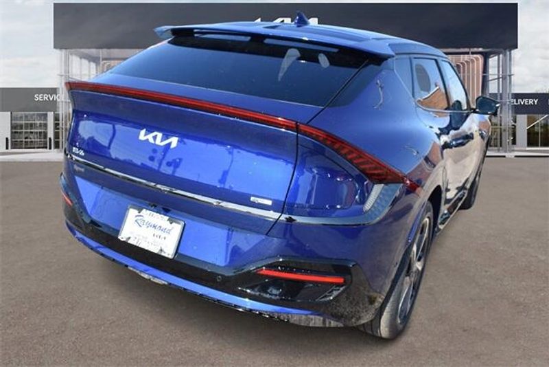 2024 Kia EV6 GT-Line in a Yacht Blue exterior color and Blackinterior. Raymond Auto Group 888-703-9950 raymonddeals.com 