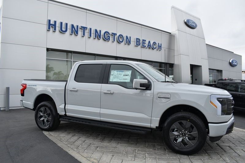 2023 Ford F-150 Lightning Lariat in a Avalanche exterior color and Blackinterior. BEACH BLVD OF CARS beachblvdofcars.com 