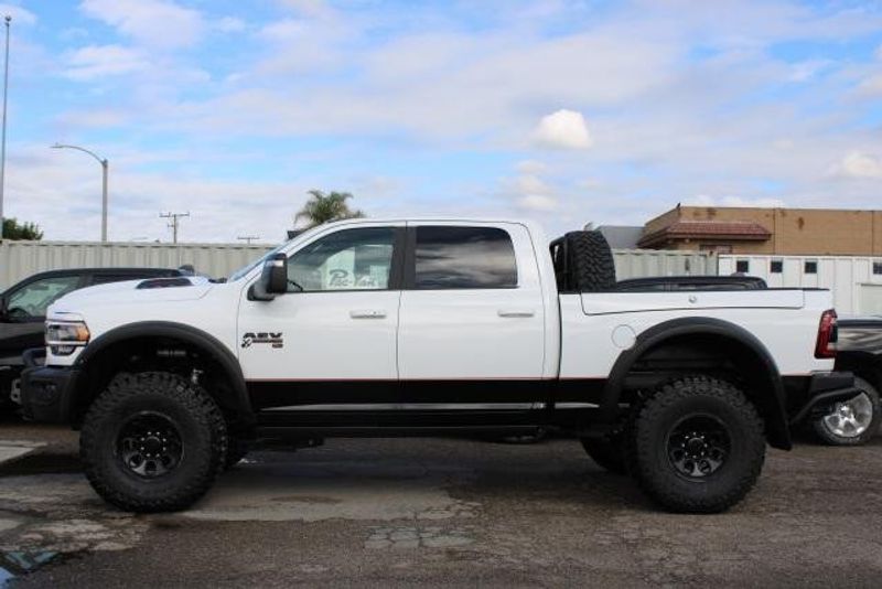 2023 RAM 2500 Laramie Crew Cab 4x4 in a Bright White exterior color and Blackinterior. BEACH BLVD OF CARS beachblvdofcars.com 