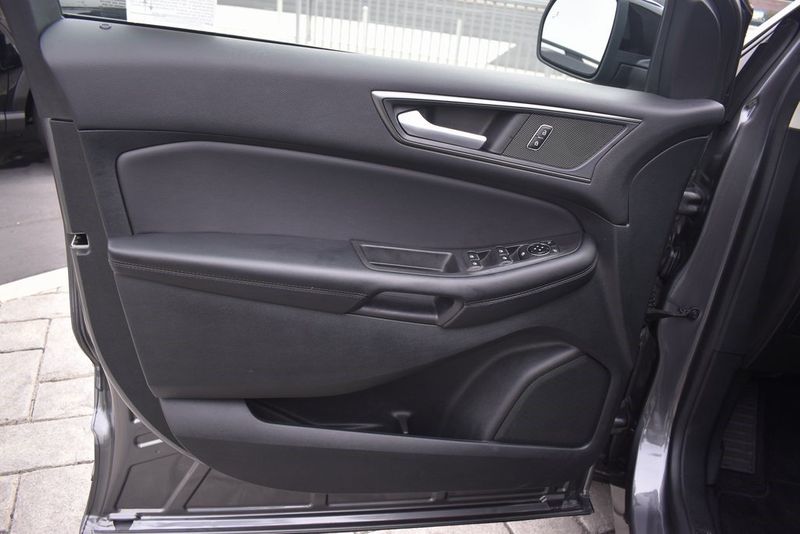 2023 Ford Edge SE in a Carbonized Gray Metallic exterior color and Ebonyinterior. BEACH BLVD OF CARS beachblvdofcars.com 