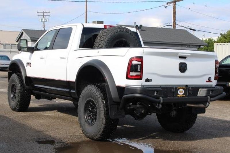 2023 RAM 2500 Laramie Crew Cab 4x4 in a Bright White exterior color and Blackinterior. BEACH BLVD OF CARS beachblvdofcars.com 