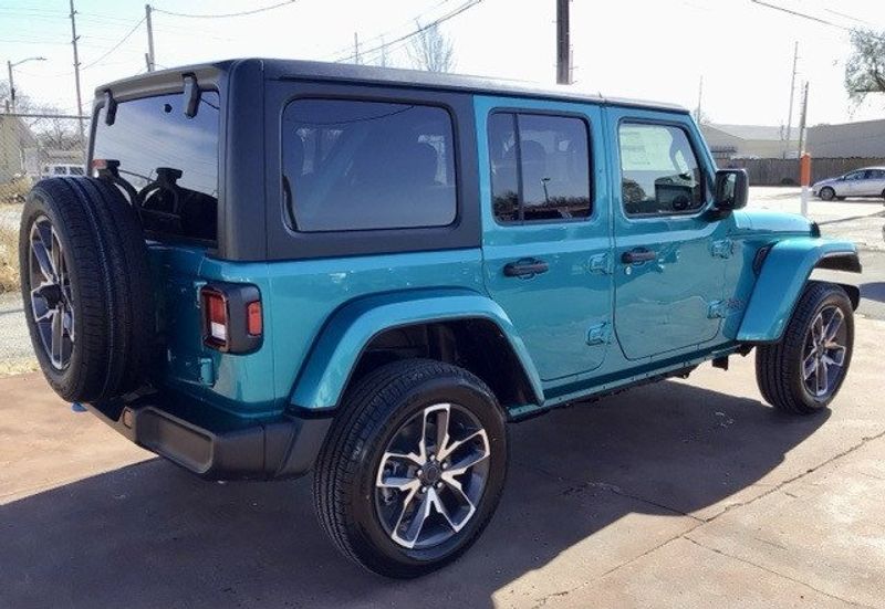 2024 Jeep Wrangler 4-door Sport S 4xe in a Bikini Pearl Coat exterior color and Blackinterior. Matthews Chrysler Dodge Jeep Ram 918-276-8729 cyclespecialties.com 