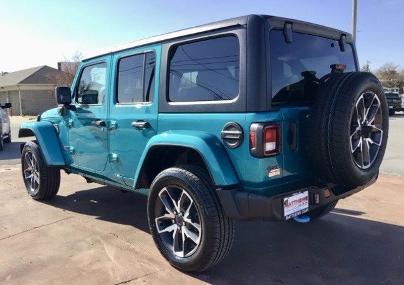 2024 Jeep Wrangler 4-door Sport S 4xe in a Bikini Pearl Coat exterior color and Blackinterior. Matthews Chrysler Dodge Jeep Ram 918-276-8729 cyclespecialties.com 