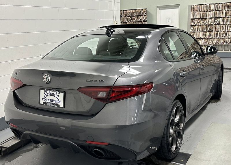 2021 Alfa Romeo Giulia Ti Sport Nero AWD w/Sunroof & Nav in a Vesuvio Gray Metallic exterior color and Black Heated Sport Leatherinterior. Schmelz Countryside Alfa Romeo (651) 867-3222 schmelzalfaromeo.com 