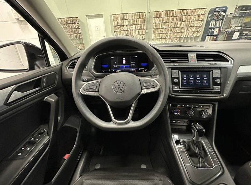 2023 Volkswagen Tiguan S / Driver Asst Pkg in a Deep Black Pearl exterior color and Black Heated Seatsinterior. Schmelz Countryside SAAB (888) 558-1064 stpaulsaab.com 