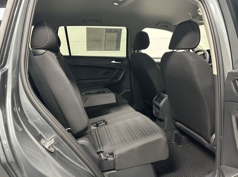 2023 Volkswagen Tiguan S w/ Dr Asst Pkg in a Platinum Gray Metallic exterior color and Black Heated Seatsinterior. Schmelz Countryside SAAB (888) 558-1064 stpaulsaab.com 