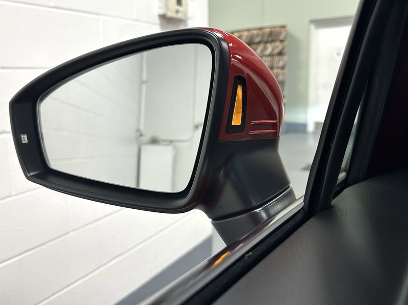 2023 Volkswagen Tiguan SE w/Sunroof & 3rd Row in a Kings Red Metallic exterior color and Black Heated Seatsinterior. Schmelz Countryside Alfa Romeo (651) 867-3222 schmelzalfaromeo.com 