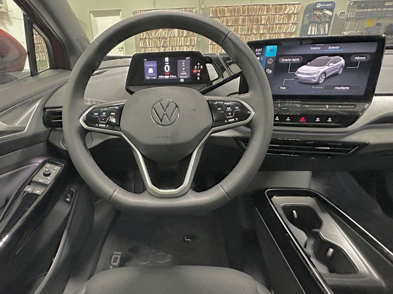 2023 Volkswagen ID.4 Pro S w/ Panoramic Roof in a Aurora Red Metallic exterior color and Black w/ Heated Massaging Seatsinterior. Schmelz Countryside Alfa Romeo (651) 867-3222 schmelzalfaromeo.com 