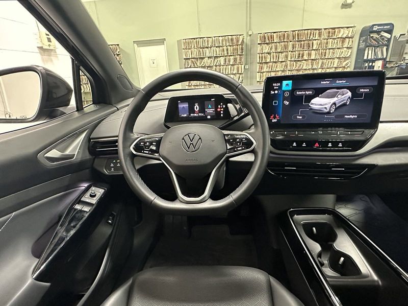 2023 Volkswagen ID.4 Pro S Plus w/Navigation in a Deep Black Pearl exterior color and Black Heated Massaging Seatsinterior. Schmelz Countryside SAAB (888) 558-1064 stpaulsaab.com 