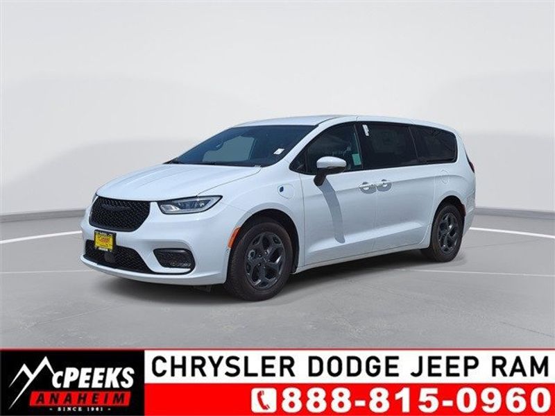 2023 Chrysler Pacifica Plug-in Hybrid Touring L in a Bright White Clear Coat exterior color and Blackinterior. McPeek