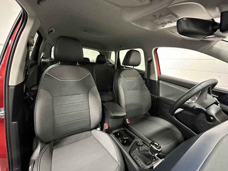 2023 Volkswagen Taos SE 4-Motion AWD w/Black Wheel Pkg in a Kings Red Metallic exterior color and Black heated seatsinterior. Schmelz Countryside SAAB (888) 558-1064 stpaulsaab.com 