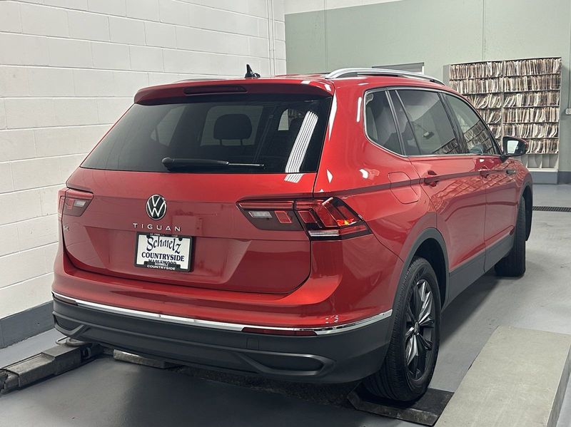 2023 Volkswagen Tiguan SE w/Sunroof & 3rd Row in a Kings Red Metallic exterior color and Black Heated Seatsinterior. Schmelz Countryside Alfa Romeo and Fiat (651) 968-0556 schmelzfiat.com 