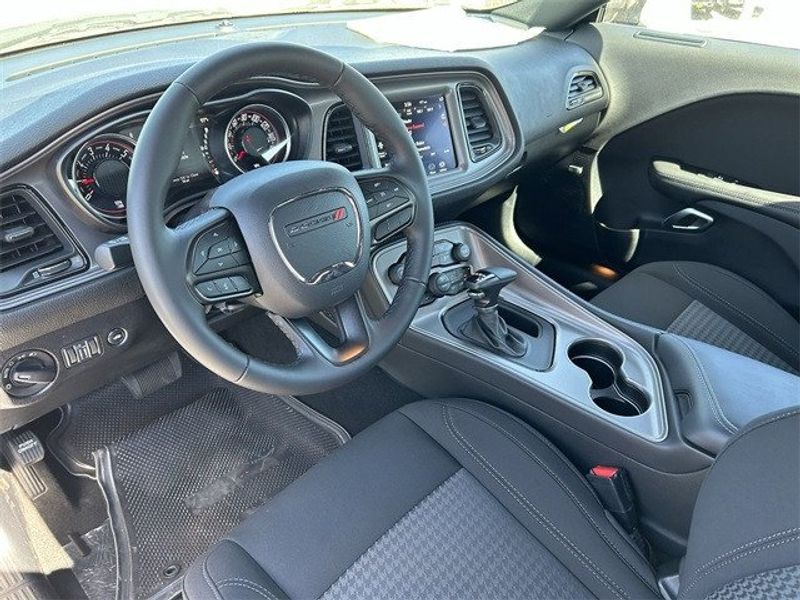 2023 Dodge Challenger SXT in a White Knuckle exterior color and Blackinterior. McPeek