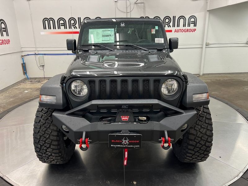 2023 Jeep Wrangler 4-door Sport S 4x4 in a Black Clear Coat exterior color and Blackinterior. Marina Chrysler Dodge Jeep RAM (855) 616-8084 marinadodgeny.com 