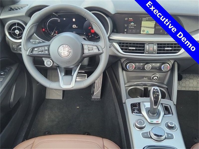 2024 Alfa Romeo Stelvio Ti Awd in a Vesuvio Gray Metallic exterior color and Chocolateinterior. Northside Alfa Romeo of Houston 281-475-4549 alfaromeousaofnorthhouston.com 