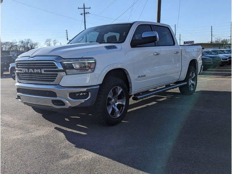 2021 RAM 1500 Laramie in a Bright White Clear Coat exterior color and Light Frost Beige/Mountain Browninterior. Johnson Dodge 601-693-6343 pixelmotiondemo.com 