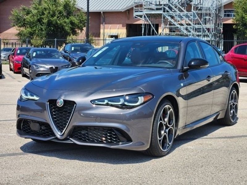 2024 Alfa Romeo Giulia Ti in a Vesuvio Gray Metallic exterior color and Blackinterior. Northside Imports Houston 281-475-4549 northsideimportshouston.com 