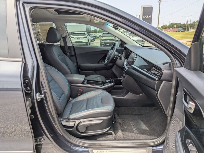 2022 Kia Niro EV EX Premium in a Gravity Blue exterior color and Charcoalinterior. Johnson Dodge 601-693-6343 pixelmotiondemo.com 