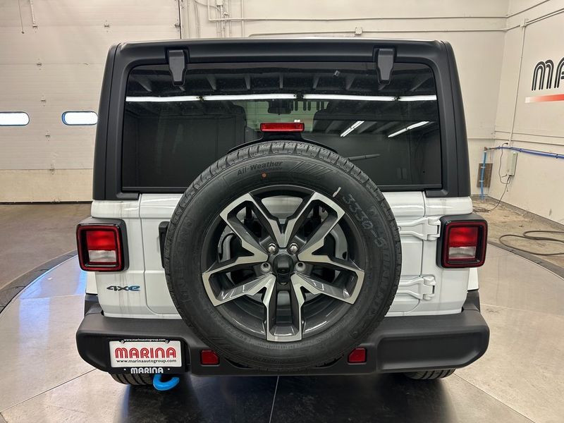 2024 Jeep Wrangler 4-door Sport S 4xe in a Bright White Clear Coat exterior color and Blackinterior. Marina Chrysler Dodge Jeep RAM (855) 616-8084 marinadodgeny.com 