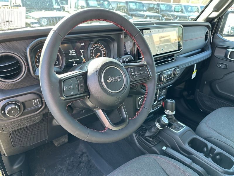 2024 Jeep Wrangler 4-door Rubicon in a Black Clear Coat exterior color and Blackinterior. Gupton Motors Inc 615-384-2886 guptonmotors.com 
