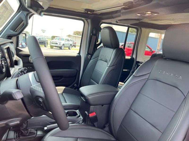 2023 Jeep Wrangler Sahara 4xe in a Silver Zynith Clear Coat exterior color and Blackinterior. Lakeshore CDJR Seaford 302-213-6058 lakeshorecdjr.com 